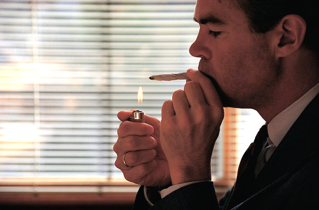 Man Smoking At Work